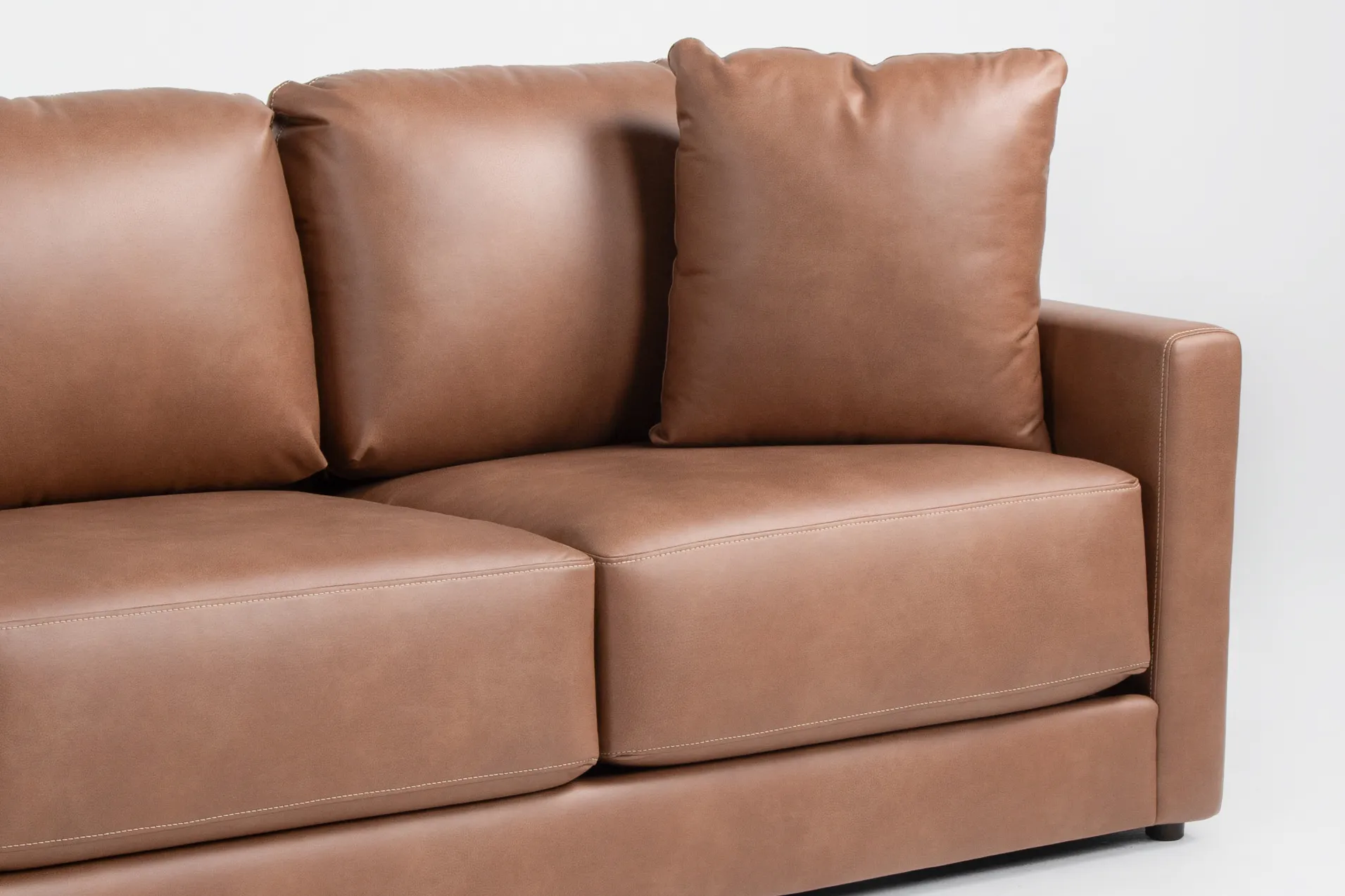 alicia saddle brown vegan faux leather 140" 4 piece sectional & ottoman 14 alicia saddle brown vegan faux leather 140" 4 piece sectional & ottoman