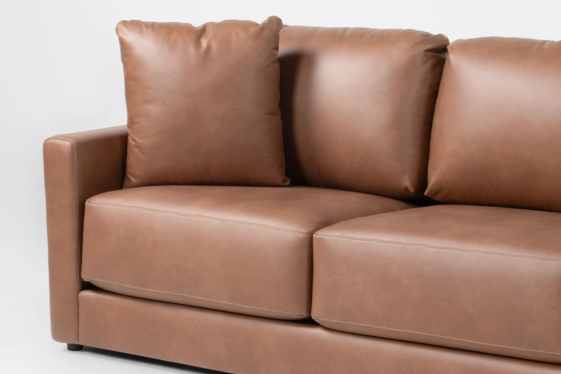 alicia saddle brown vegan faux leather 138" 3 piece sectional with right arm facing chaise & ottoman 12 alicia saddle brown vegan faux leather 138" 3 piece sectional with right arm facing chaise & ottoman